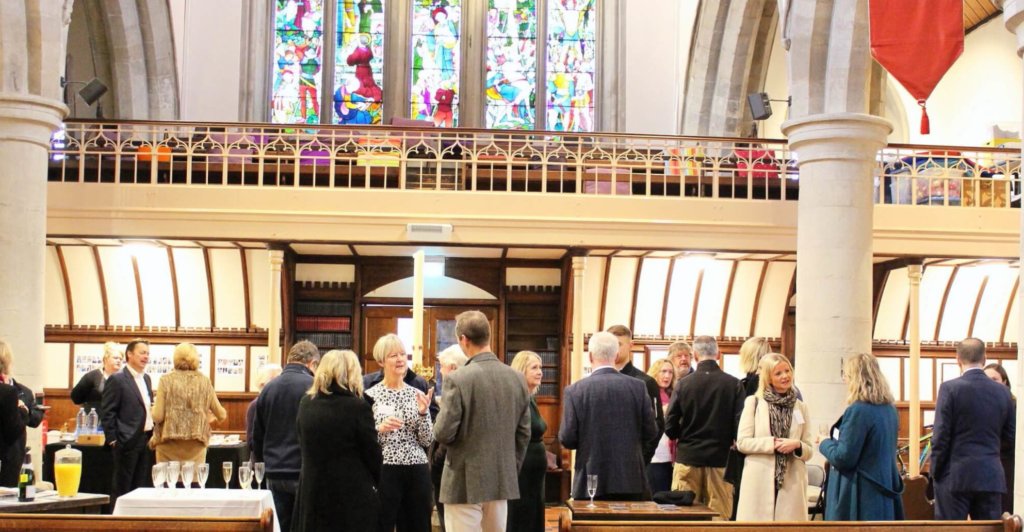 Chamber members networking in a St Peters church